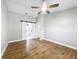 Main bedroom with barn doors to ensuite bathroom at 15901 Greater Groves Blvd, Clermont, FL 34714