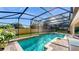 Large, screened-in swimming pool with spa at 7614 Saint Stephens Ct, Orlando, FL 32835