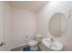 Small powder room with toilet and sink at 1714 Wynford Cir, Tavares, FL 32778