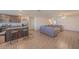 Open concept kitchen and living room with L-shaped sectional sofa at 1714 Wynford Cir, Tavares, FL 32778