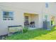 Small patio with seating and grill at 1714 Wynford Cir, Tavares, FL 32778