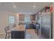 Modern kitchen with granite countertops and stainless steel appliances at 1714 Wynford Cir, Tavares, FL 32778