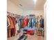 Large walk-in closet with ample hanging space and shelving at 1714 Wynford Cir, Tavares, FL 32778