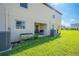 Small patio with seating and grill at 1714 Wynford Cir, Tavares, FL 32778