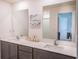 Double vanity bathroom with modern finishes and a spacious layout at 1714 Wynford Cir, Tavares, FL 32778