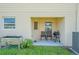 Small patio with seating and grill at 1714 Wynford Cir, Tavares, FL 32778