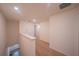 Upstairs hallway with carpet and access to bedrooms at 1714 Wynford Cir, Tavares, FL 32778