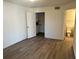 Spacious bedroom with wood-look floors and ample closet space at 4105 Tropical Isle Blvd # 238, Kissimmee, FL 34741