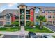 Three-story apartment building with multiple units and ample parking at 4105 Tropical Isle Blvd # 238, Kissimmee, FL 34741