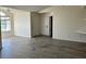 Spacious living room with wood-look floors and access to balcony at 4105 Tropical Isle Blvd # 238, Kissimmee, FL 34741