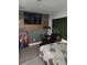 Cozy bedroom with a recliner and a large TV at 1149 Holden Ave, Orlando, FL 32839