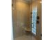 Large walk-in shower with glass enclosure and decorative tile at 3336 Edgecliffe Dr, Orlando, FL 32806