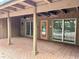 Covered patio with brick pavers, ceiling fans, and access to pool at 3336 Edgecliffe Dr, Orlando, FL 32806