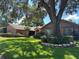 Beautiful home exterior with brick and wood siding, and lush landscaping at 3336 Edgecliffe Dr, Orlando, FL 32806