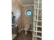 Bathroom with toilet, glass block shower, and floral wallpaper at 3336 Edgecliffe Dr, Orlando, FL 32806