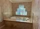 Relaxing bathroom with soaking tub and glass block window at 3336 Edgecliffe Dr, Orlando, FL 32806