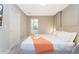 King-size bed, en-suite bathroom access, and soft bedding at 7944 Formosa Valley Pl, Kissimmee, FL 34747