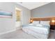 Bright bedroom with king-size bed and en-suite bathroom at 7944 Formosa Valley Pl, Kissimmee, FL 34747