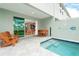 Private backyard oasis with a plunge pool, patio furniture, and sliding door access at 7944 Formosa Valley Pl, Kissimmee, FL 34747
