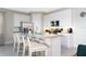 Modern kitchen with stainless steel appliances and breakfast bar at 7944 Formosa Valley Pl, Kissimmee, FL 34747