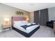 Spacious bedroom with a plush bed, modern decor, and ample natural light at 7944 Formosa Valley Pl, Kissimmee, FL 34747