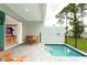 Private pool and patio with seating area and view into the living room at 7944 Formosa Valley Pl, Kissimmee, FL 34747