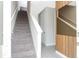 Interior view of carpeted staircase and entryway at 7944 Formosa Valley Pl, Kissimmee, FL 34747