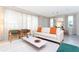 Open living space with light colored sofa and coffee table at 7944 Formosa Valley Pl, Kissimmee, FL 34747