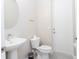 Simple half bathroom with pedestal sink and toilet at 7944 Formosa Valley Pl, Kissimmee, FL 34747