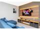 Theater room with large TV, comfortable seating, and modern decor at 7944 Formosa Valley Pl, Kissimmee, FL 34747