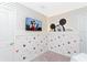Mickey Mouse themed bedroom with TV and accent wall at 7944 Formosa Valley Pl, Kissimmee, FL 34747