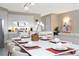 Open dining room with modern table and kitchen view at 7944 Formosa Valley Pl, Kissimmee, FL 34747