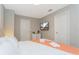 King-size bed, mounted TV, and dresser at 7944 Formosa Valley Pl, Kissimmee, FL 34747