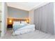 Bright bedroom with a king-size bed and modern wood headboard at 7944 Formosa Valley Pl, Kissimmee, FL 34747