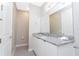 Clean bathroom with granite countertop and toilet at 7944 Formosa Valley Pl, Kissimmee, FL 34747
