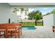 Private pool area with patio furniture and fenced-in backyard at 7944 Formosa Valley Pl, Kissimmee, FL 34747