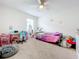 Bright bedroom with a bed, desk, and plenty of storage at 1526 White Hawk Way, Groveland, FL 34736