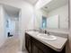 Bathroom with double vanity and mirror at 1526 White Hawk Way, Groveland, FL 34736