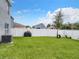 Spacious backyard with grassy area and privacy fence at 1526 White Hawk Way, Groveland, FL 34736