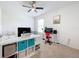 Bedroom with built-in shelving and workspace at 1526 White Hawk Way, Groveland, FL 34736