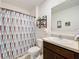 Neat bathroom featuring a shower, toilet, and updated vanity at 1526 White Hawk Way, Groveland, FL 34736