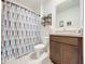 Clean bathroom with shower/tub combo and vanity at 1526 White Hawk Way, Groveland, FL 34736