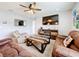 Gathering room with large TV and comfortable seating area at 1526 White Hawk Way, Groveland, FL 34736