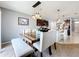 Kitchen dining area with a large wooden table and bench seating at 1526 White Hawk Way, Groveland, FL 34736
