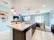 Open concept kitchen with island and seating, view of dining area at 1526 White Hawk Way, Groveland, FL 34736