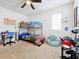 bedroom with bunk bed, desk, and musical instrument at 1526 White Hawk Way, Groveland, FL 34736