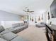 Bonus room with sectional sofa and guitars on the wall at 1526 White Hawk Way, Groveland, FL 34736