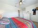 Well-lit bedroom with a cozy bed and ample storage at 1526 White Hawk Way, Groveland, FL 34736