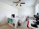 Bedroom with bed and workspace at 1526 White Hawk Way, Groveland, FL 34736