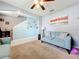 Open living room featuring a teal accent wall and comfortable seating at 1526 White Hawk Way, Groveland, FL 34736